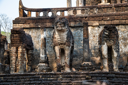 Ancient elephant statue in Chang Lom temple, Thailand.