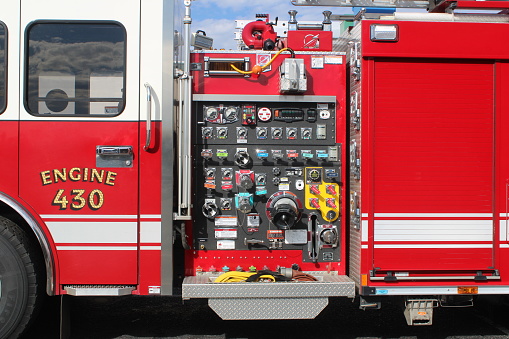 A powerful water pump and foaming unit with pressure sensors, valves and taps are located in the middle of the cargo compartment of the equipped fire truck.