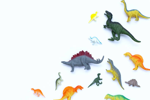 istock Plastic dinosaur toys on white background. Top view 1452814669