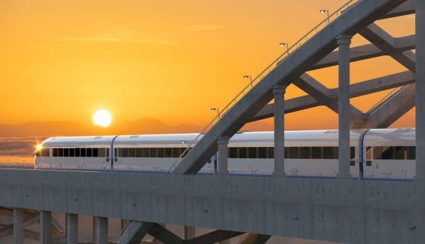 Modern high-speed train traveling on a concrete bridge