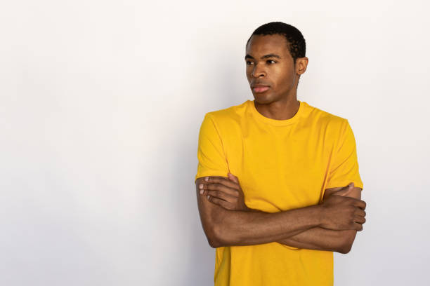 istock Portrait of serious young man looking away 1452830166