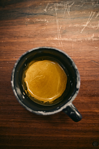 Espresso cup on wood background, selective focus