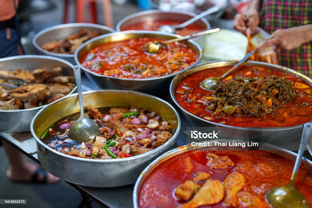 Various choice of food for picking at market stall, known as economy rice in Malaysia Economy rice with wide variety of dishes , popular cheap meal in Malaysia Chinese Culture Stock Photo