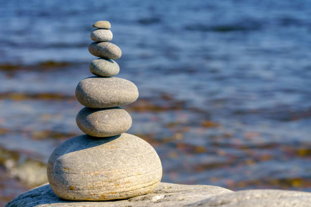 istock Pyramid of stones. Unstable balance of stone objects. 1452836471