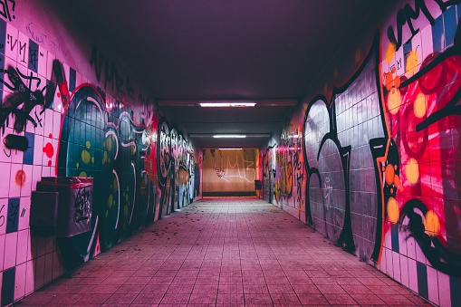 Buenos Aires, Argentina – November 24, 2021: A beautiful graffiti art on the wall of an empty tunnel in Buenos Aires, Argentina