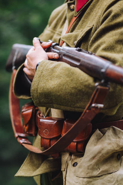 istock View of a soldier with a gun on a blurred background 1452838360