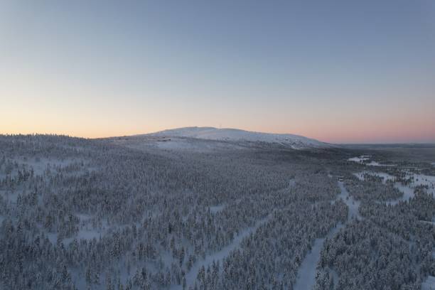 istock Aerial view of a hut in a snowy forest 1452838461