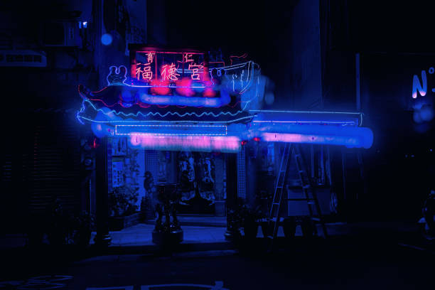 Taipei, Taiwan – February 16, 2022: A small shrine illuminated with neon lights at night in Taipei, Taiwan
