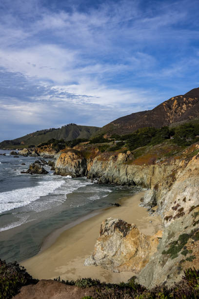 istock Vertical shot of a coastal landscape with cliffs under a cloudy sky 1452840000