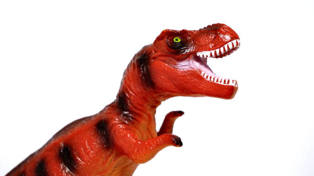 istock screamy red dinosaur toy isolated on white background 1452842244