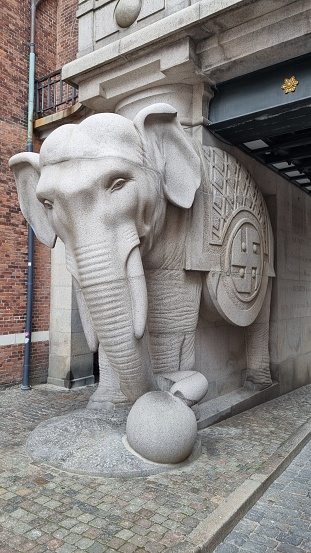 Copenhagen, Denmark – October 04, 2021: A vertical shot of the elephant statue at the gate of the old Carlsberg brewery in Vesterbro