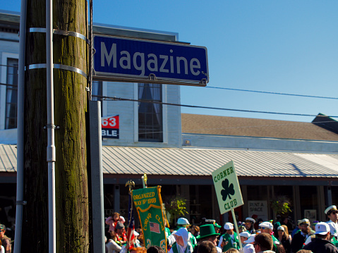 New Orleans, United States – March 12, 2022: A beautiful shot of people in the street celebrating of St. Patricks Day Parade in New Orleans, USA