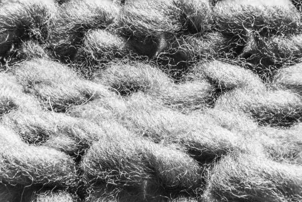 Texture backdrop photo of grey colored double knitted fabric surface.