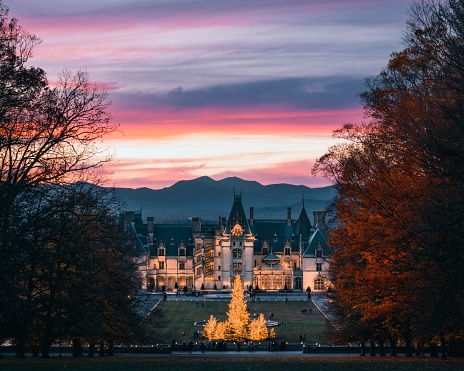 Asheville, United States – November 17, 2021: A beautiful scene of the Biltmore Museum in Asheville, North Carolina during the Christmas Holidays at Sunset