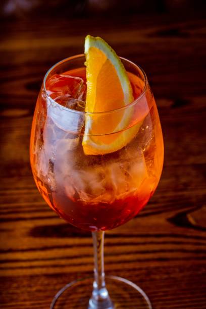 istock Vertical shot of refreshing cocktail with an orange slice 1452846344