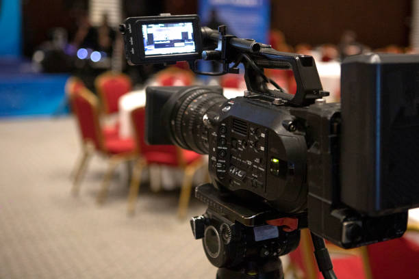 istock Video camera taking live video streaming with people working background at meeting room. Selective focus. stock photo. 1452846677
