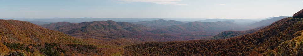 a sweeping panoramic shot of the blue ridge parkway mountains in the fall
