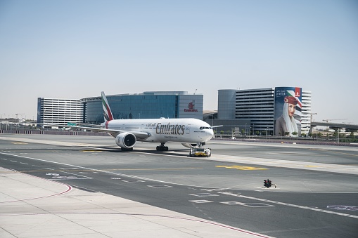 Dubai, United Arab Emirates – May 02, 2022: A beautiful shot of an EMIRATES large passenger plane on the land ready at the airport in Dubai, UNITED ARAB EMIRATES