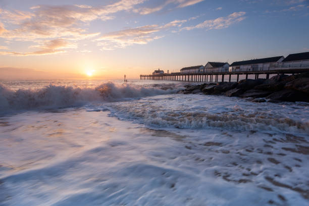 Southwold Pier on the Suffolk Coast at sunrise Long Exposure photography of Southwold Pier on the Suffolk Coast at sunrise southwold stock pictures, royalty-free photos & images