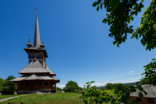 Susani, Maramures, Romania - July 07, 2022: The wooden church of Calinesti Susani in the Maramures of Romania