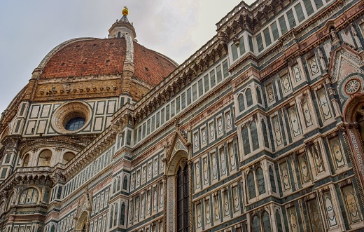 Florence, Itlay - September 04, 2022: Crowd in front of the Cathedral of Santa Maria del Fiore, the symbol of the city. In the foreground the Battistero di San Giovanni