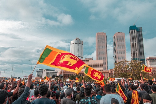 Colombo, Sri Lanka – May 09, 2021: The protesters holding flags of Sri Lanka in Colombo