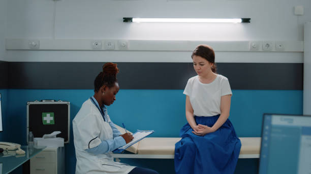 istock African american medic consulting patient in doctors office 1452851136