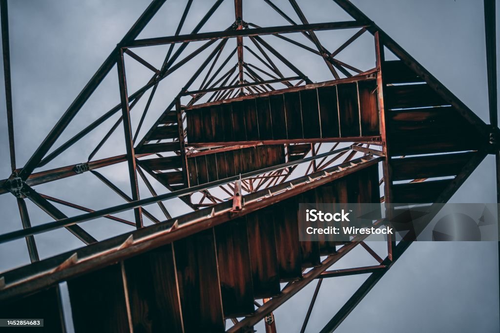 Low angle shot of fire tower stairs against the blue sky A low angle shot of fire tower stairs against the blue sky Architecture Stock Photo