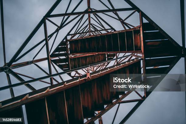 Low Angle Shot Of Fire Tower Stairs Against The Blue Sky Stock Photo - Download Image Now