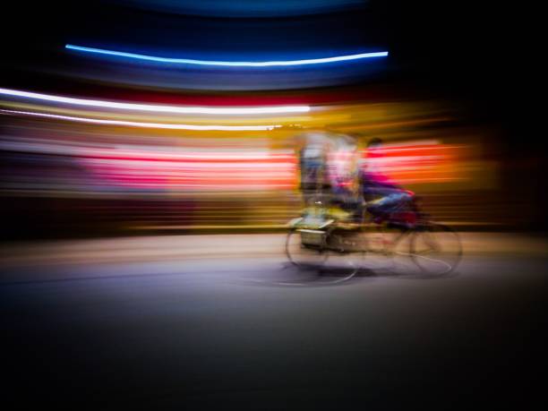 istock Long exposure shot of a person riding a bicycle and carrying stuff 1452854708