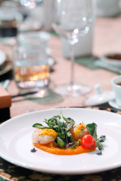 istock Seared sea scallops served on white plate, fine dining 1452857025