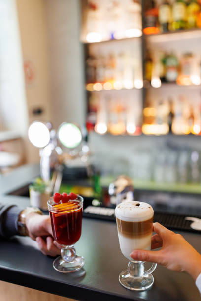 istock Couple enjoying favorite drinks at cafe 1452858849