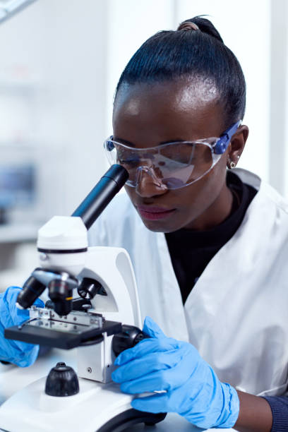 istock Close up of chemist of african ethnicity doing sample analysis 1452859177