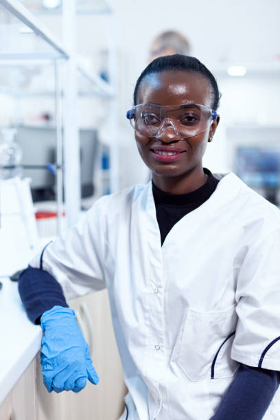 istock African scientist wearing protective glasses in medical laboratory 1452860681