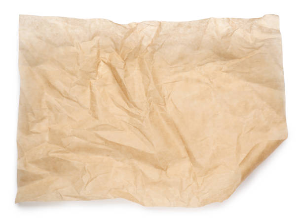 istock Sheet of crumpled brown baking paper on white background, top view 1452861516