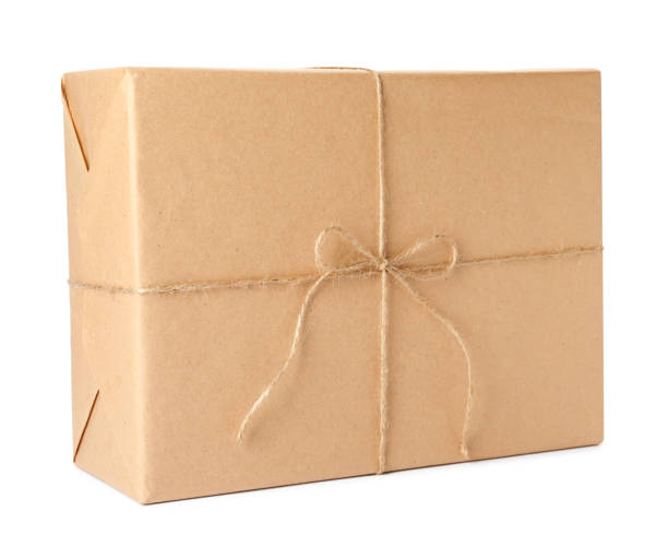 istock Parcel wrapped with kraft paper and twine isolated on white 1452861904