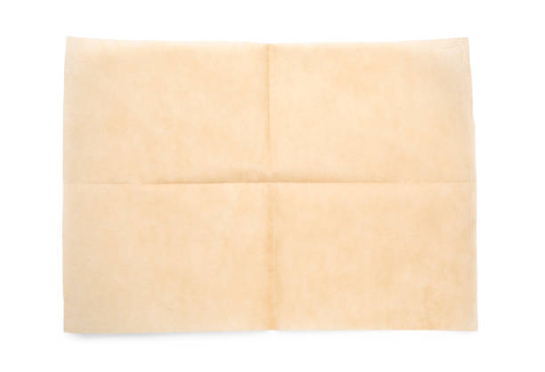 Sheet of brown baking paper on white background, top view