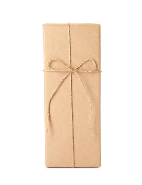 istock Parcel wrapped with kraft paper and twine isolated on white 1452862060