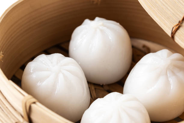 istock Steamed dumplings and soy sauce isolated on white background 1452863619