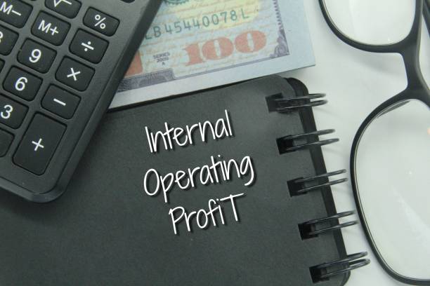 istock banknotes, glasses, calculators and notebooks with the words internal operating profit 1452864744