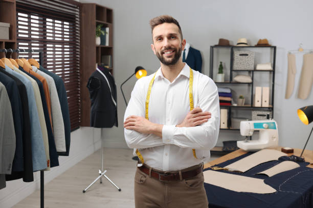 istock Professional tailor with measuring tape in workshop 1452867106