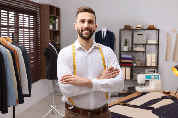 istock Happy dressmaker with measuring tape in workshop 1452867477