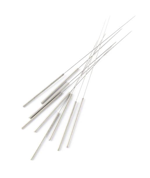 istock Many needles for acupuncture on white background 1452867805