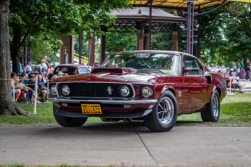 Des Moines, IA - July 03, 2022: Low perspective front corner view of a 1969 Ford Mustang Boss 429 Fastback at a local car show.