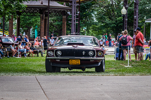 Des Moines, IA - July 03, 2022: Wide angle front view of a 1969 Ford Mustang Boss 429 Fastback at a local car show.