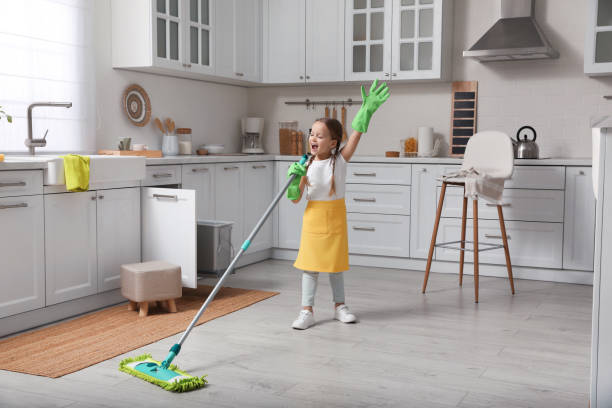 Cute little girl with mop singing while cleaning at home Cute little girl with mop singing while cleaning at home chores stock pictures, royalty-free photos & images