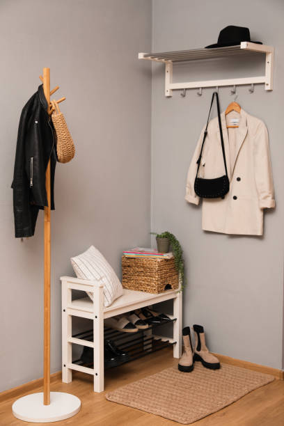 istock Modern hallway interior with shoe rack and wooden coat stand 1452869250