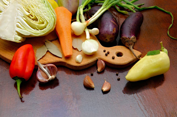Photo of various vegetables standing on a kitchen board ready for chopping