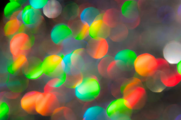 Colorful glittering ball blur on black background