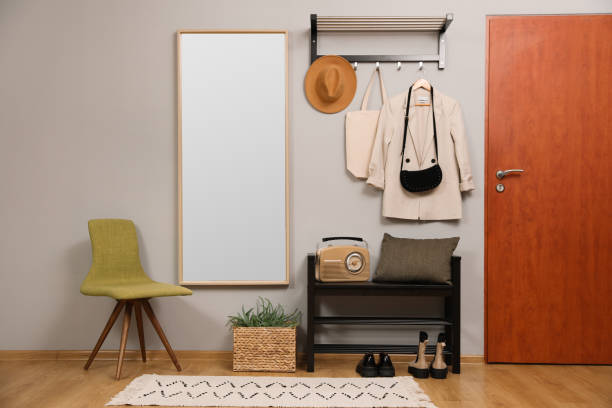 istock Modern hallway interior with stylish chair, shoe rack and mirror 1452870345